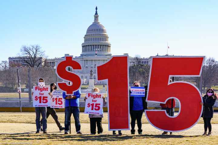 Activists appeal for a $15 minimum wage near the Capitol in Washington.